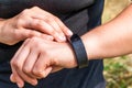 Girl checks the information on the screen of fitness band