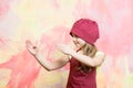 Girl in chef hat and apron with karate hand gesture