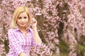 Girl with Cherry Blossom. Beautiful Blonde Royalty Free Stock Photo