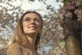 Girl with Cherry Blossom. Beautiful Blonde Young Woman. Royalty Free Stock Photo