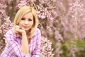 Girl with Cherry Blossom. Beautiful Young Woman Royalty Free Stock Photo