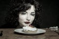 Girl with cherry fancy cake Royalty Free Stock Photo