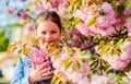 Girl cherry flower background. Sakura tree blooming. Park and garden. Girl little child in spring flower bloom. Enjoy Royalty Free Stock Photo