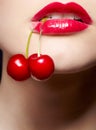 Girl with cherry in mouth Royalty Free Stock Photo