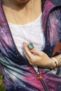Chest detail in space jacket with labradorite pendant on silver chain Royalty Free Stock Photo