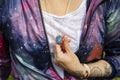 Chest detail in space jacket with labradorite pendant on silver chain Royalty Free Stock Photo