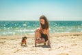 Girl and Chihuahua. A little girl with her pet chihuahua dog. A girl is played with a dog at the sea Royalty Free Stock Photo