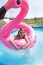 Girl child bathes in the pool Royalty Free Stock Photo