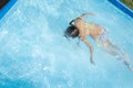 Girl child bathes in the pool Royalty Free Stock Photo