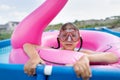 Girl child bathes in the pool Royalty Free Stock Photo