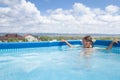 Girl child bathes in the pool Royalty Free Stock Photo