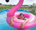 Girl child bathes in the pool Royalty Free Stock Photo