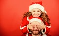 Girl child and bearded father wear santa costume. How to be santa claus parents guide. My dad is santa claus. Belief in