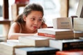 Girl child, books in library and education, story for knowledge or entertainment with customer in bookshop. Learning for