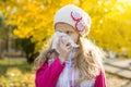 Girl child with cold rhinitis on autumn background. Royalty Free Stock Photo