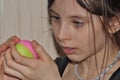 The girl, a child doing Christmas decorations.