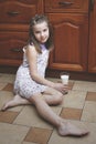 The girl child with a glass of milk