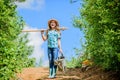 Girl child hold shovel watering can. Spring gardening checklist. Little helper. Watering tools that will solve dry yard Royalty Free Stock Photo