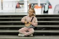 Girl child listen music indoors with modern headphones. Kid little girl listen song headphones. Music account playlist