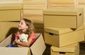 Girl child play box. Move out concept. Prepare for moving. Moving out. Packaging things. Excited about new house. Sweet