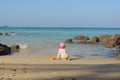 Girl child playing on the beach . Summer outdoor kids activity concept