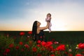 Girl with a child in a poppy field Royalty Free Stock Photo
