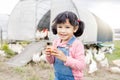 Girl child portrait, chicken farm and egg with smile, learning or organic agriculture startup in spring. Kid, poultry Royalty Free Stock Photo