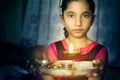 Girl child portrait holding prayer plate welcoming