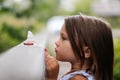 Girl child sad looks at a toy boat in the park Royalty Free Stock Photo