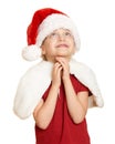Girl child in santa hat pray, white isolated, christmas holiday concept