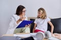 Girl child at session with female psychologist counselor social worker in office Royalty Free Stock Photo