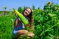 Girl child small farmer proud with harvest, garden background