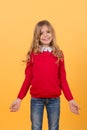 Girl child with smile in red sweater and blue jeans Royalty Free Stock Photo