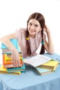 The girl child at the table with books