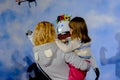 The girl and the child talking to a smart robot