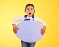 Girl child, thinking and speech bubble in studio with wow, news and mockup space by yellow background. Young female kid