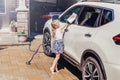 girl child washing cleaning car Royalty Free Stock Photo