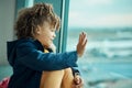 Girl child, wave and airport window for greeting, goodbye and smile for airplane, international transport and travel Royalty Free Stock Photo