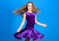 Girl child wear velvet violet dress. Kid fashionable dress looks adorable. Ballroom dancewear fashion concept. Kid