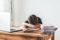 girl child 6 years old sitting at a desk in front of a laptop and sleeping Royalty Free Stock Photo