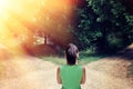 Girl with a choice near the forked road.The concept of the solution: the path to success and the path of risk Royalty Free Stock Photo