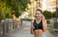 Girl choose music for running on smartphone Royalty Free Stock Photo