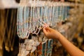 girl chooses beads on a display window in a store Royalty Free Stock Photo