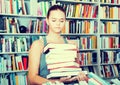 Girl chooses a book in university library Royalty Free Stock Photo