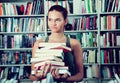 Girl chooses a book in university library Royalty Free Stock Photo