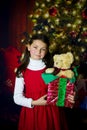 Girl with Christmas present Royalty Free Stock Photo