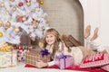 Girl, Christmas tree, gifts and toys Royalty Free Stock Photo