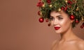 Girl with christmas wreath on her head. Brown background