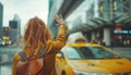 Girl with city leather backpack calling yellow taxi cab raising arm-waving gesture in the city airport arrival zone. Traveling,