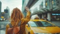 Girl with city leather backpack calling yellow taxi cab raising arm-waving gesture in the city airport arrival zone. Traveling,